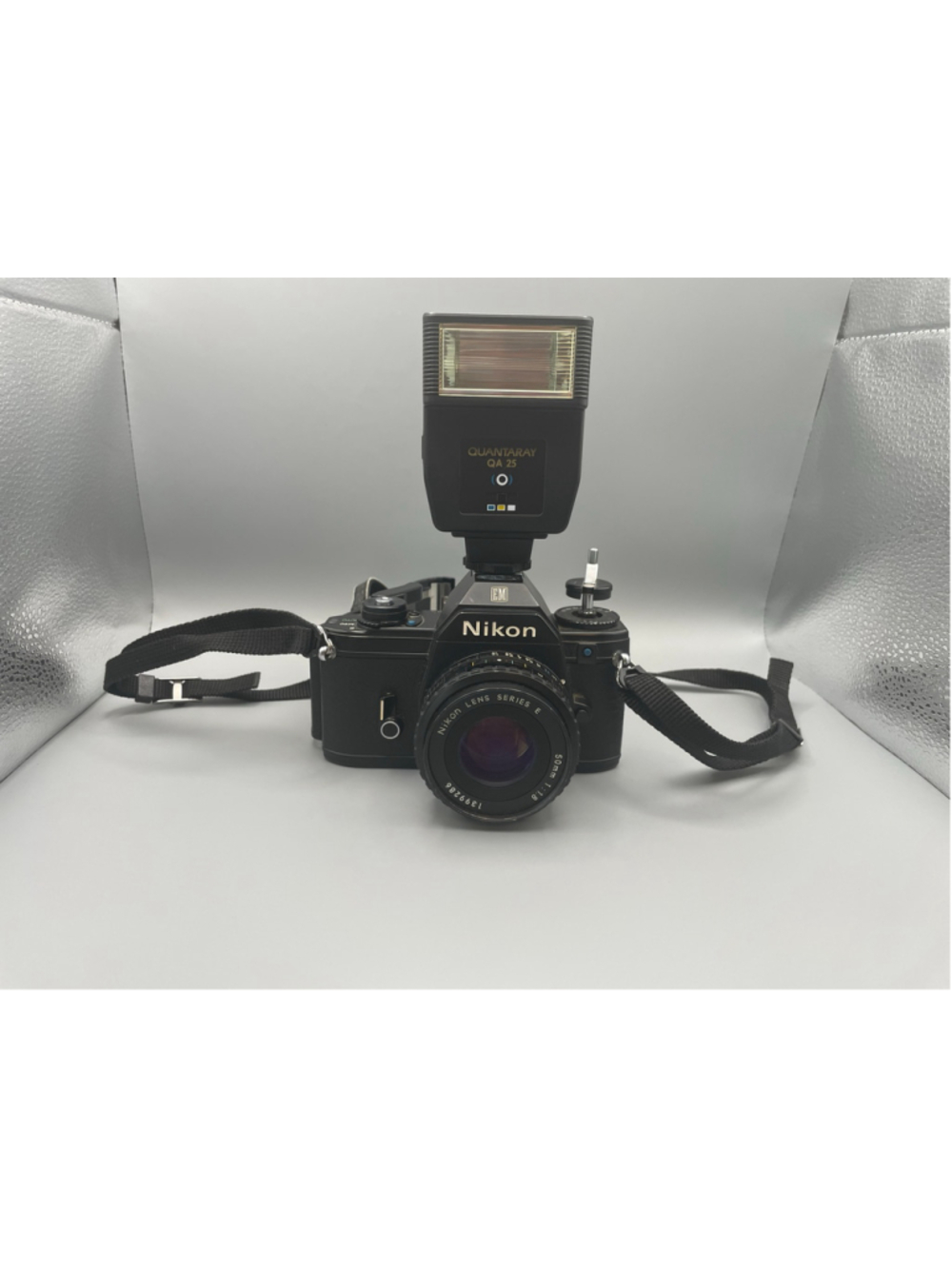 Nikon EM 35mm Film Camera with 50mm f/1.8 Lens and Quantaray Flash Untested